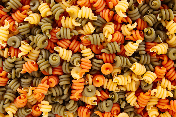 Directly above view of tricolor raw trottole pasta