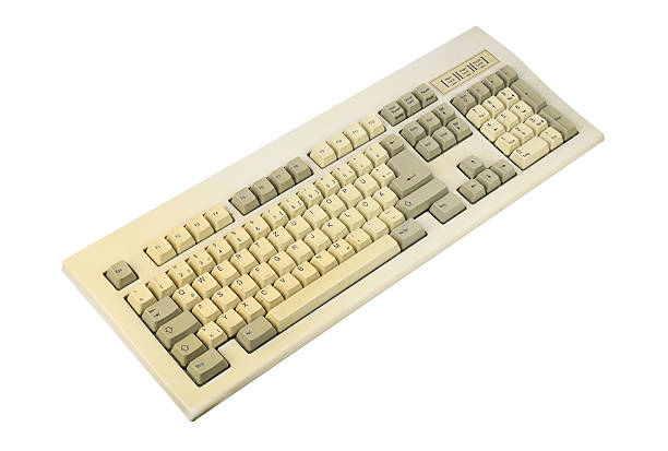 istock Vintage computer keyboard from the 1990s isolated on white background. 2218413340