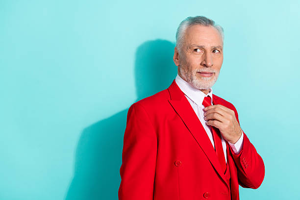 istock Photo of thoughtful man pensioner dressed red three piece tux looking back empty space isolated teal color background 2218414302