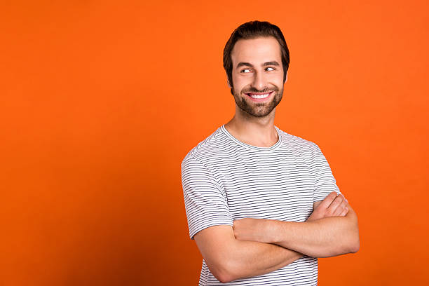 istock Profile side photo of young guy crossed hands look empty space idea thoughtful isolated over orange color background 2218414572