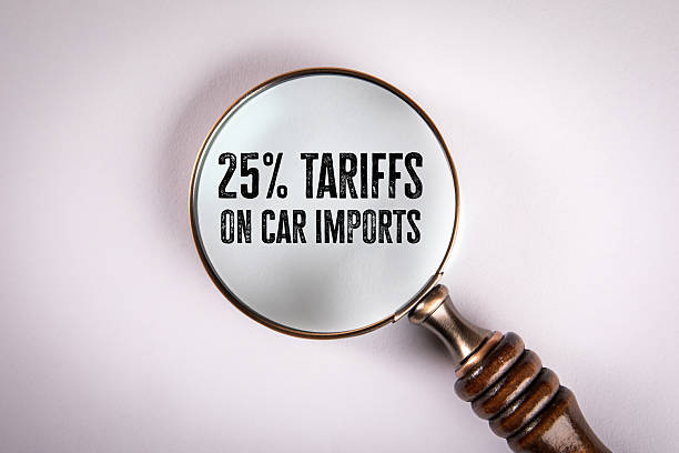 istock Magnifying Glass Focusing on 25% Tariffs on Car Imports 2218416080