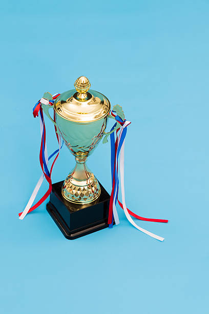 istock Golden trophy on blue background 2218422146