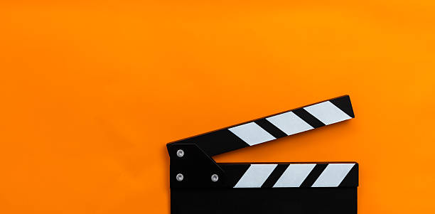 istock Film slate on orange background 2218423028