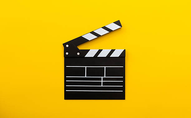 istock Single film slate on yellow background 2218423029