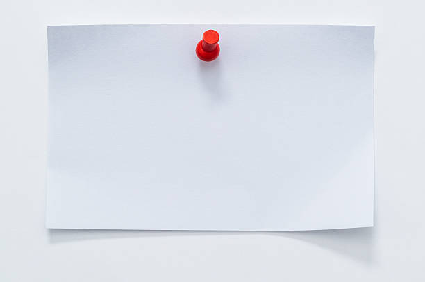 istock White note paper with red thumbtack on the board 2218423106