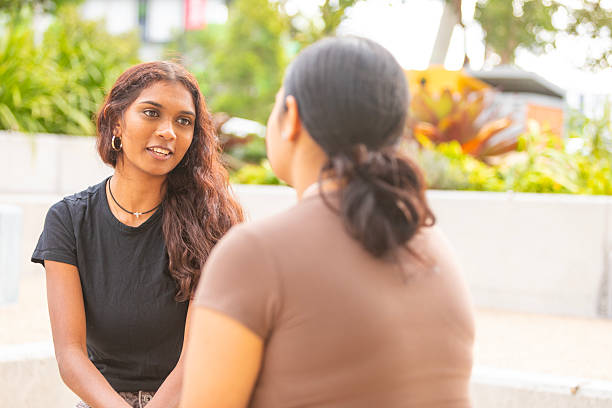 istock Young Australian Aboriginal women talking outside together 2218423120
