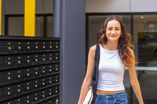 istock Young women leaving an apartment building 2218423238