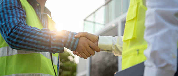 istock Construction team hands shaking greeting start up plan new project contract in office center at construction site, industry ,architecture, partner, teamwork, agreement, property, contacts. 2218424502