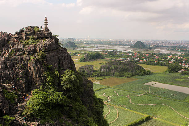istock Temple on top of Vietnam hill overlooking rice fields 2218425192