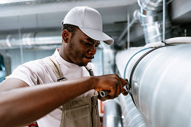 istock Skilled technician repairs piping system in industrial facility during daytime 2218425733