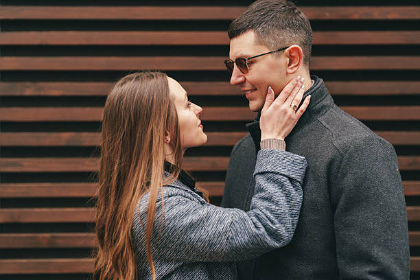 istock Young couple sharing a romantic moment outdoors in a city setting during a sunny day 2218426925