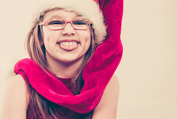 Red reindeer antlers on a moss green background, minimalist winter holidays composition, Christmas concept.
