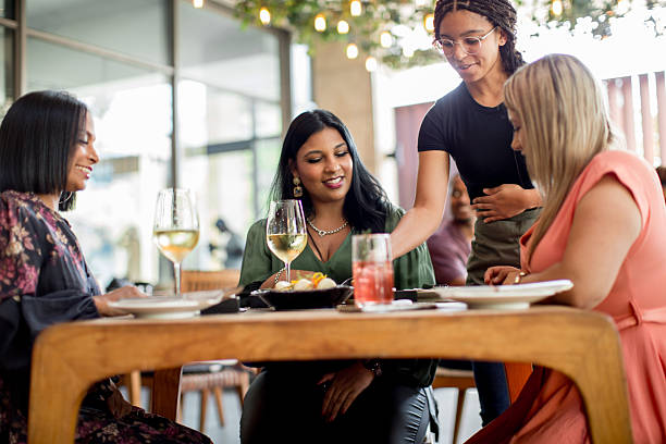 istock Waiters delivering asian food orders in a restaurant 2218430946