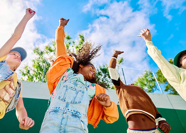 istock Multiethnic group of students dancing together in the schoolyard 2218430987