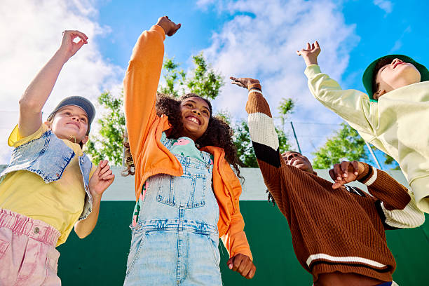istock Multiethnic group of students dancing together in the schoolyard 2218431019