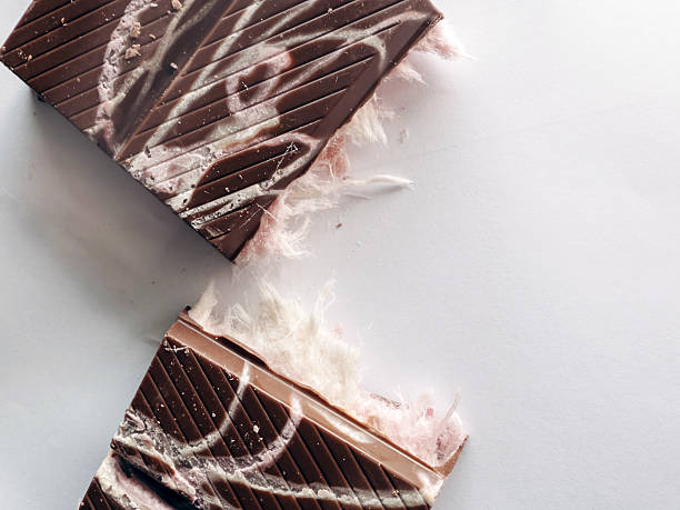 istock Gourmet chocolate dessert topped with delicate angel hair strands on solid background, minimalistic presentation of sweet and artistic confectionery 2218433760