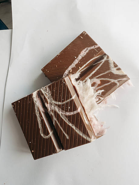 istock Gourmet chocolate dessert topped with delicate angel hair strands on solid background, minimalistic presentation of sweet and artistic confectionery 2218433780