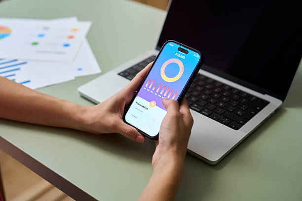 istock Businesswoman using mobile app for checking financial charts and transactions 2218434946