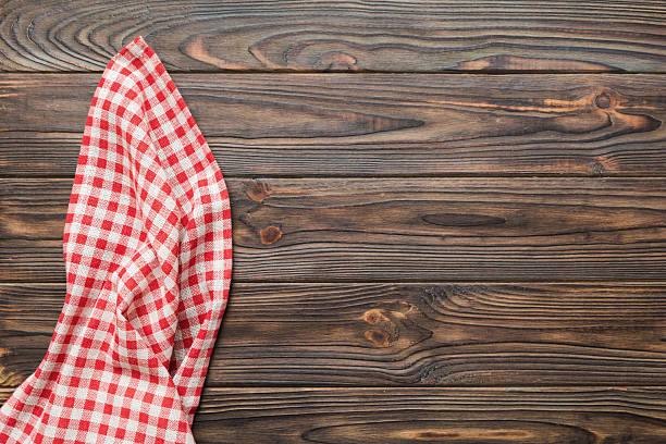istock top view with red empty kitchen napkin isolated on table background. Folded cloth for mockup with copy space, Flat lay. Minimal style 2218440271