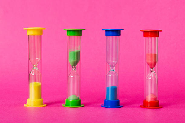 istock hourglass on the table, sand clock as time passing concept for business deadline, copy space 2218440304