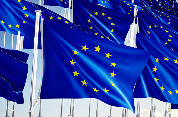 istock Many european union flags over blue sky background. 2218447129