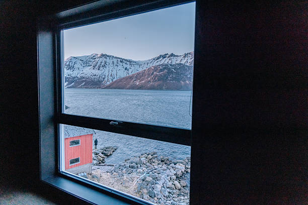 istock Snow-Capped Mountains and Fjord View Through Window 2218447233