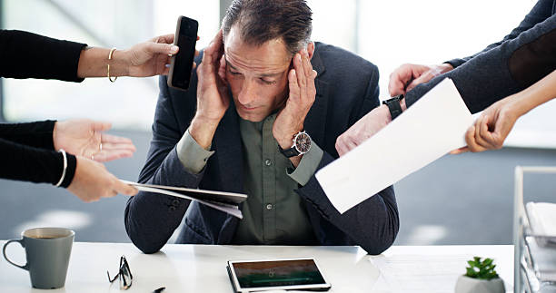 istock Business man, hands or headache for multitasking in office with corporate pressure, procrastination or anxiety. Bad time management, employer or overwhelmed with stress, phone call or report deadline 2218447905