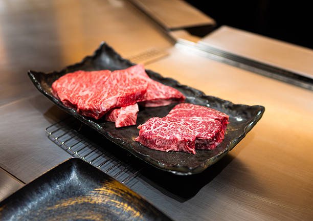 istock Premium Cuts of Raw Wagyu Beef on Ceramic Tray 2218450862