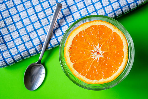 London UK, June 02 2025, Half A Fresh Orange In A Bowl As A Healthy Snack Or Breakfast