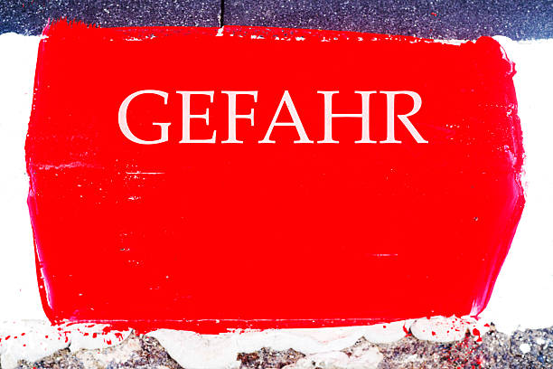 German letters Gefahr on red sidewalk border stone