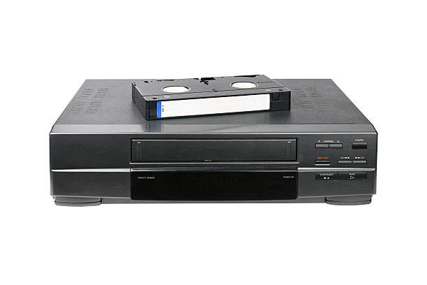 istock Classic VCR with cassette lying on top isolated on white background. 2218454841