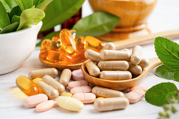 istock Alternative medicine herbal organic capsule drug herb. 2218457377