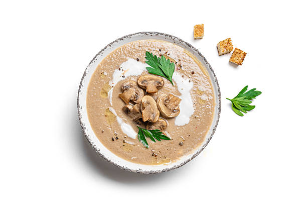 istock Mushroom cream soup with croutons isolated 2218459021