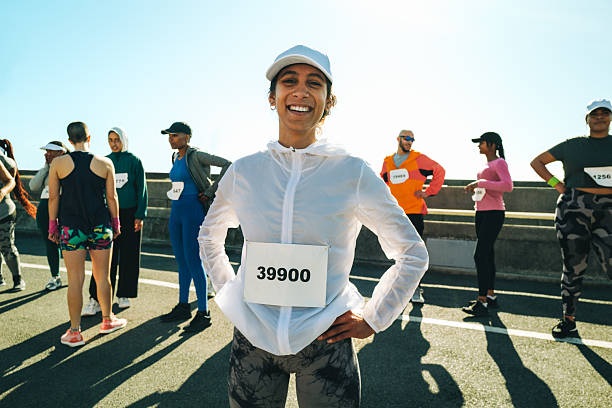 istock Confident female runner smiling before a marathon race 2218462339