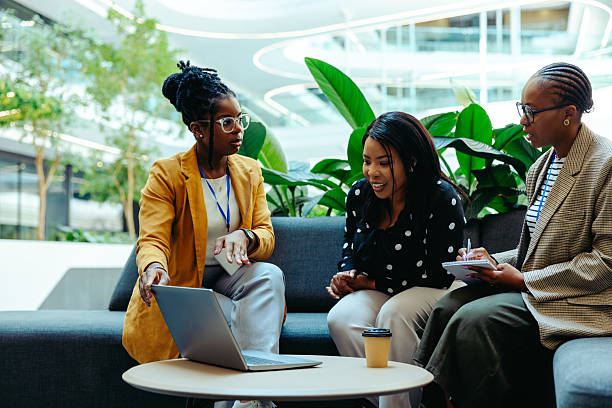 istock Accounting professionals discuss finance strategies in a modern office setting 2218463692