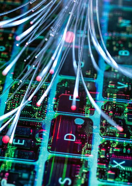 istock Glowing fiber optic cables over a circuit board, representing digital communication. 2218463793