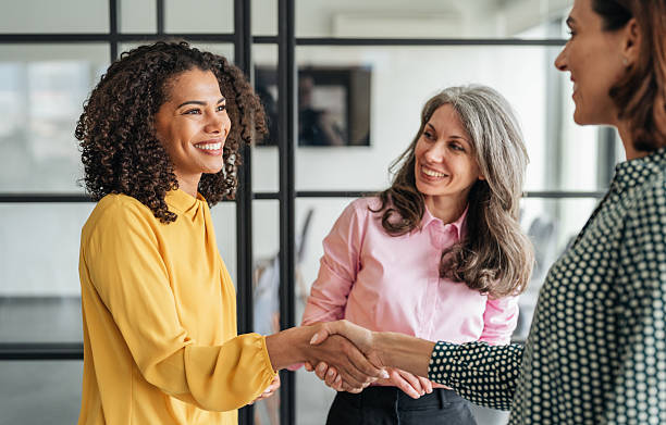 istock Business people shaking hands in the office 2218464353