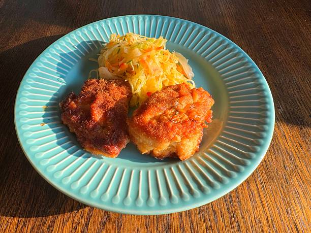 Traditional Polish dish of cabbage salad and fried chicken