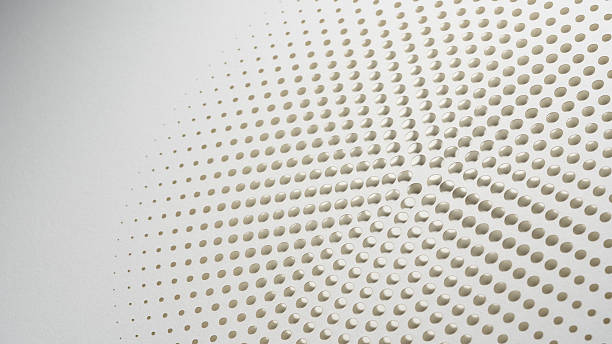 istock Minimalist radial paper cut artwork with circular perforations forming a halftone pattern on textured white background 2218466104