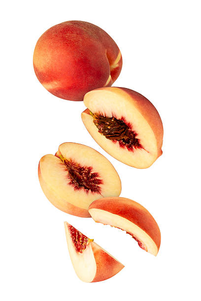 istock Falling Peach isolated on white background with clipping path, full depth of field 2218469359
