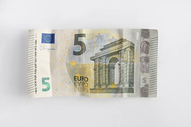 Five Euro Banknote Slightly Wrinkled on Light Background – Accidentally Washed