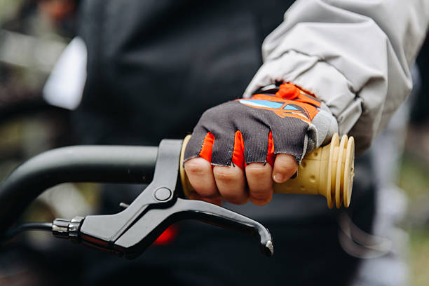 istock young boy hand on handlebars of bicycle 2218473498