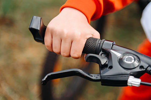 istock young boy hand on handlebars of bicycle 2218473506