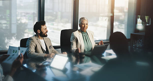 istock Meeting, collaboration and people with documents, boardroom and discussion for stats, team and company. Corporate, colleagues and analysis of charts in business, planning or communication for updates 2218477034