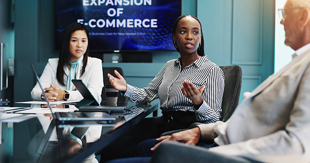 istock Planning, group and colleagues in boardroom, discussion and tech with market analysis for business. Collaboration, team and people with paperwork for stats, e commerce and brainstorming for expansion 2218477040