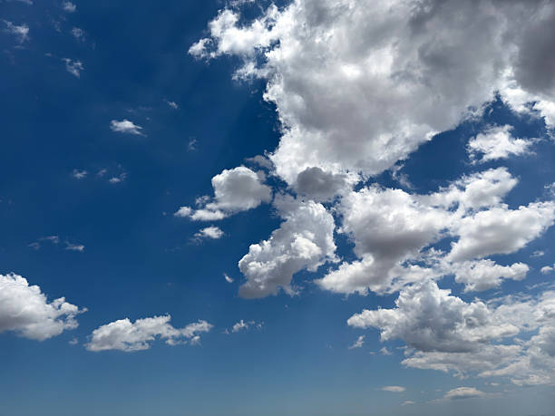 istock Blue sky with clouds background, sunny day. White and grey fluffy cloudscape 2218478330