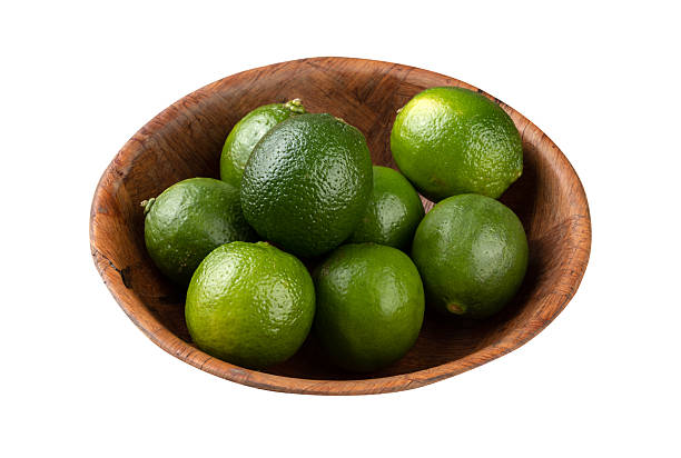 istock Lemons in a bowl isolated over white background 2218478958
