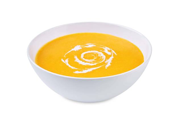 istock Pumpkin soup in a bowl on a white isolated background 2218479782