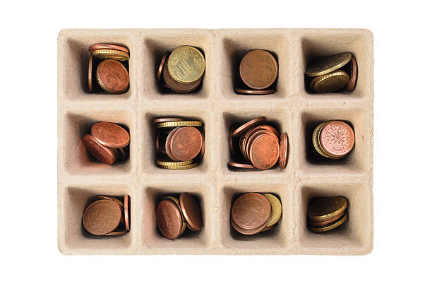 istock Small savings concept with coins in paper seed tray cell 2218481976