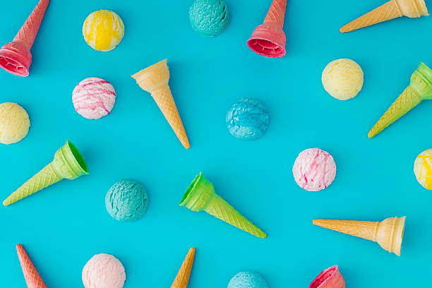 istock Trendy colorful pattern made of various ice cream cones and ice cream scoops on light blue background. Minimal summer concept. Yummy sweet food idea. Vibrant flat lay backdrop. Top view wallpaper. 2218482165